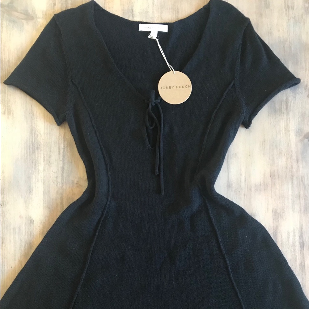 Knit dress.low neck line, tie up in the front.